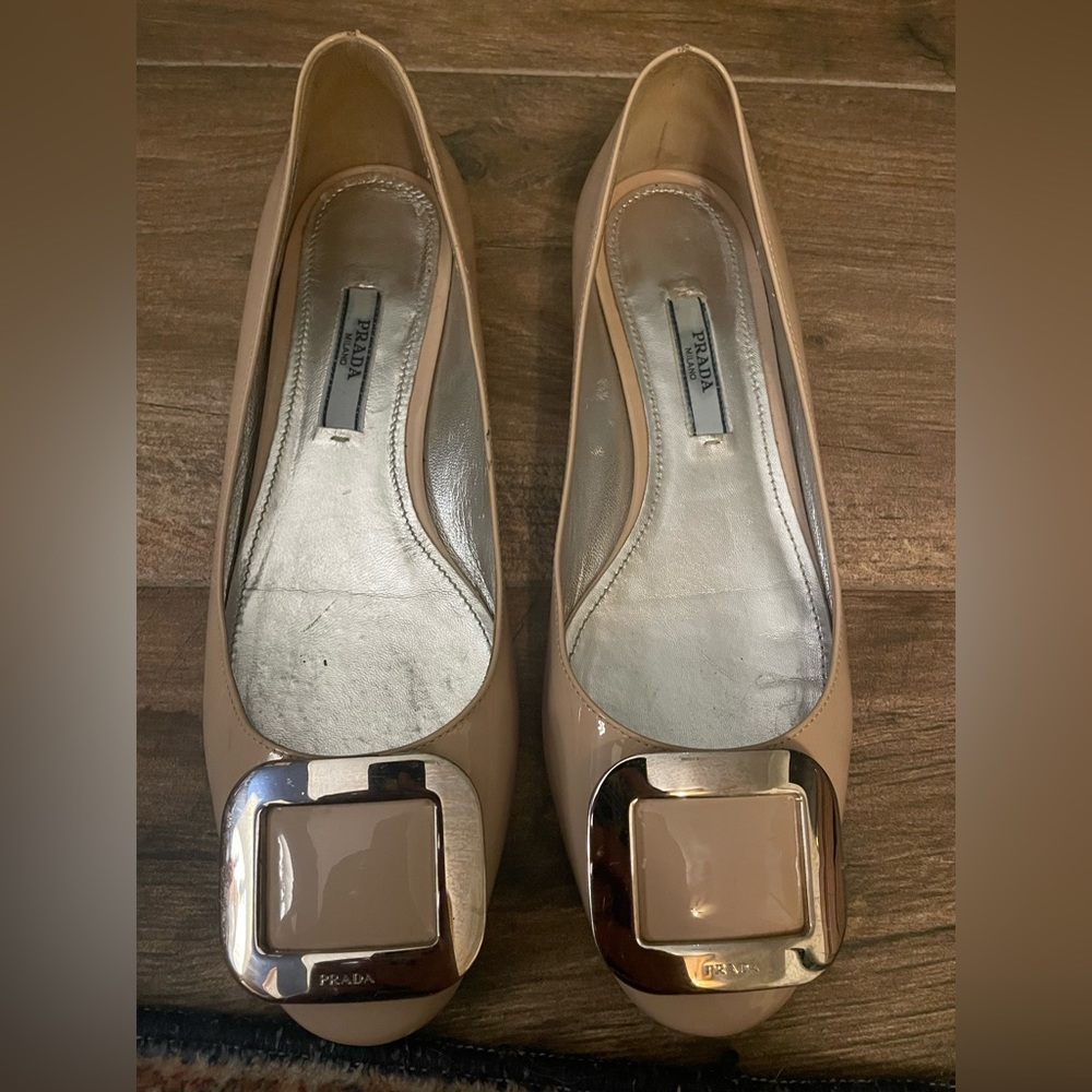 Nude patent leather PRADA flats w/ silver buckle detail